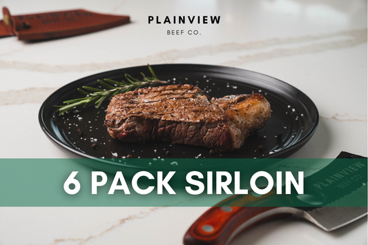 Seared Kansas sirloin steak on plate with rosemary – premium sprout-finished beef.