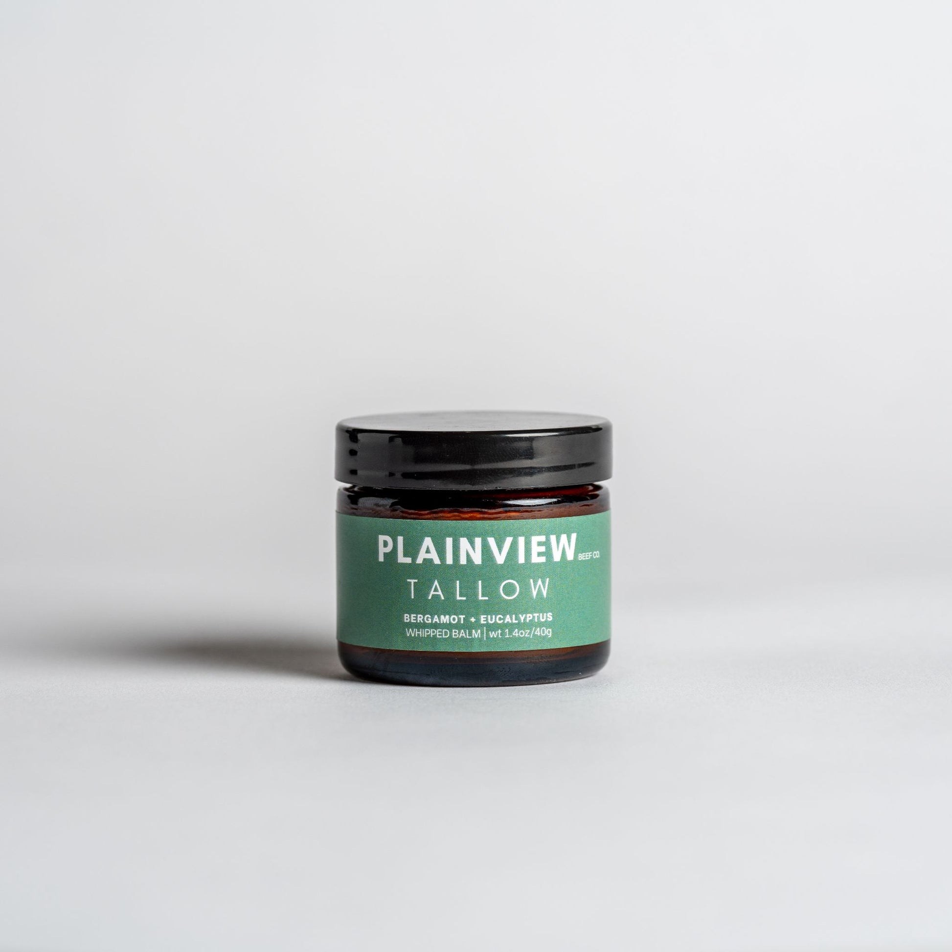 Jar of eucalyptus and bergamot tallow balm – natural spot treatment and redness relief.