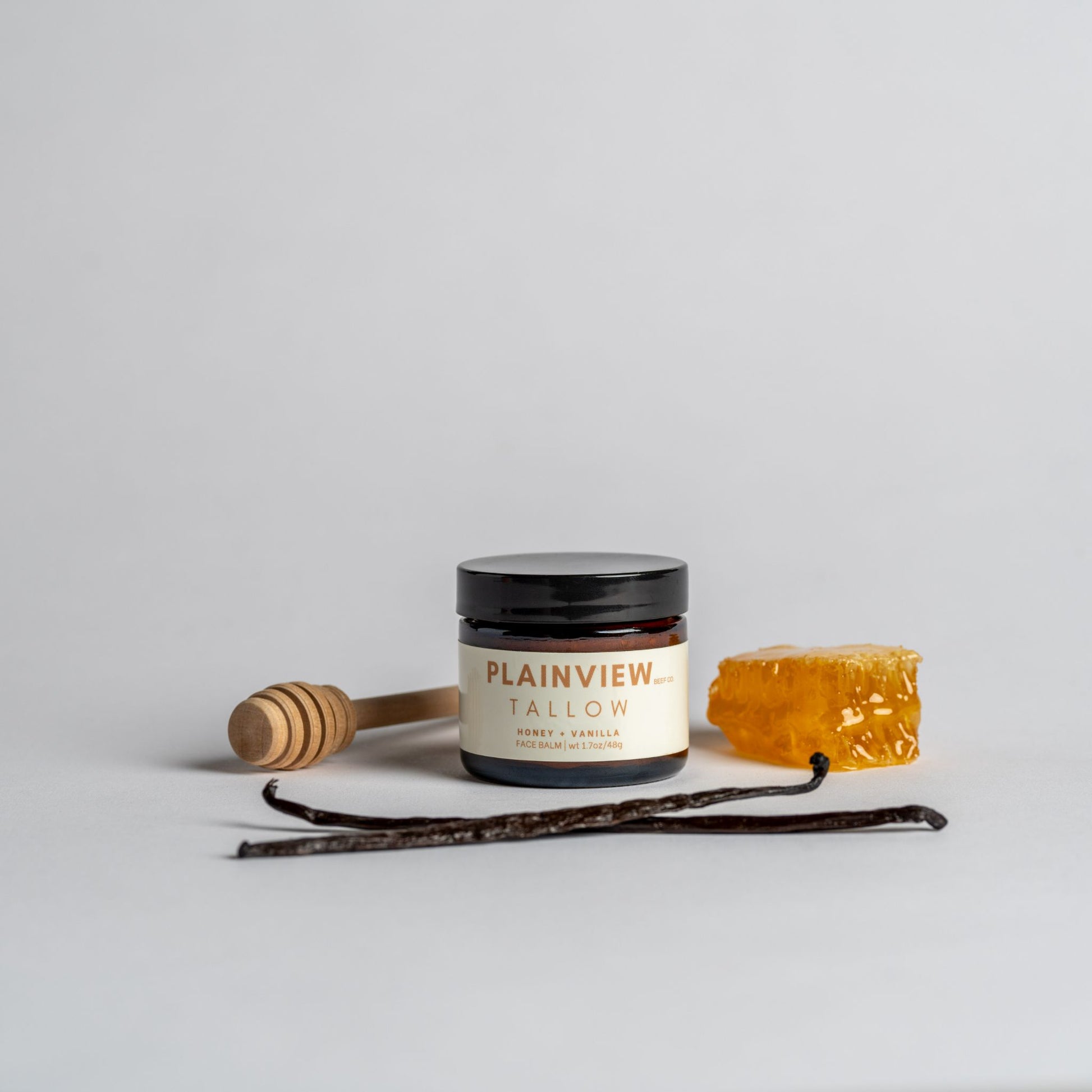 honey and vanilla tallow jar with honey, vanilla bean, and honeycomb