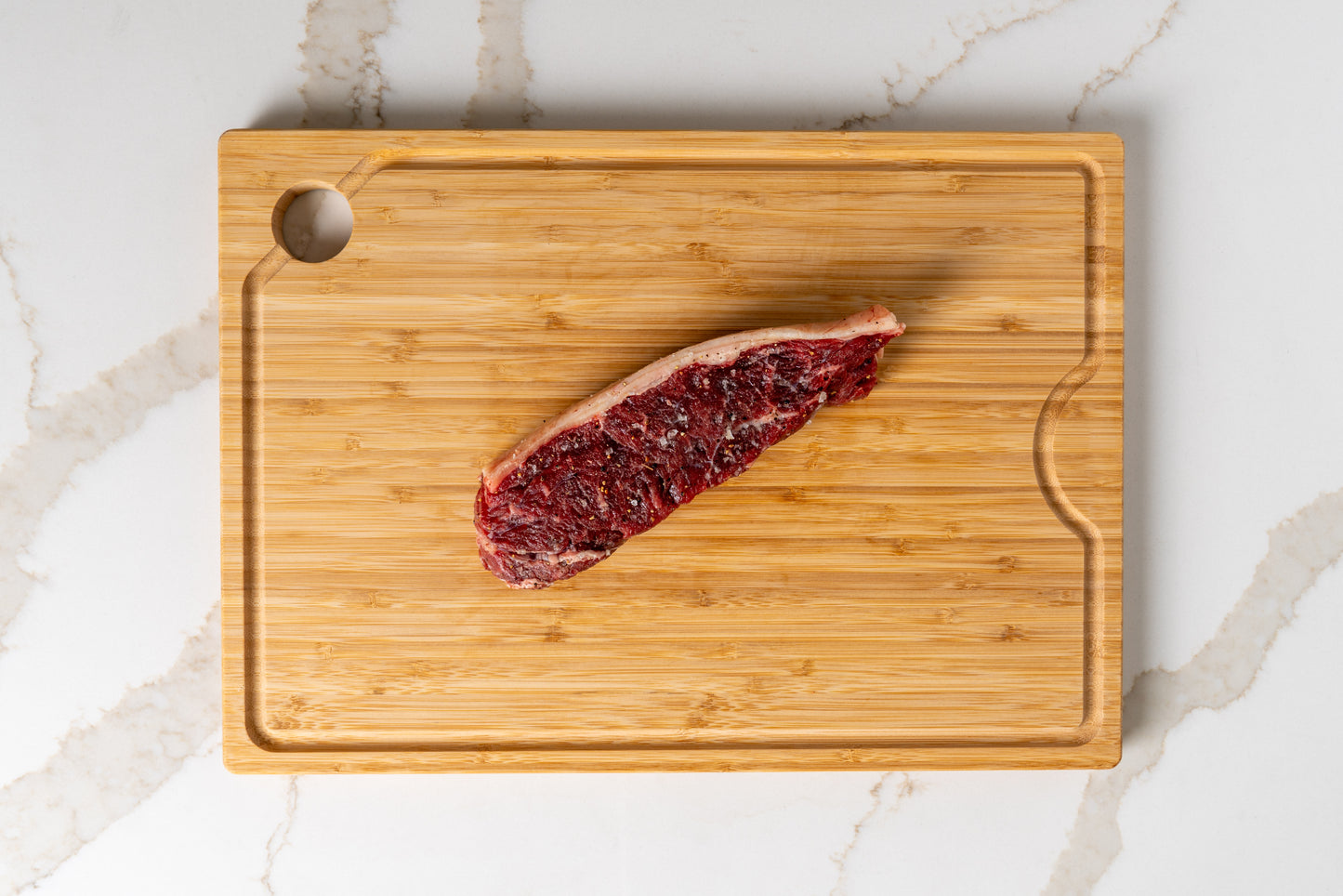 Raw KC strip steak – hand-cut 14oz Kansas beef, heritage meets innovation