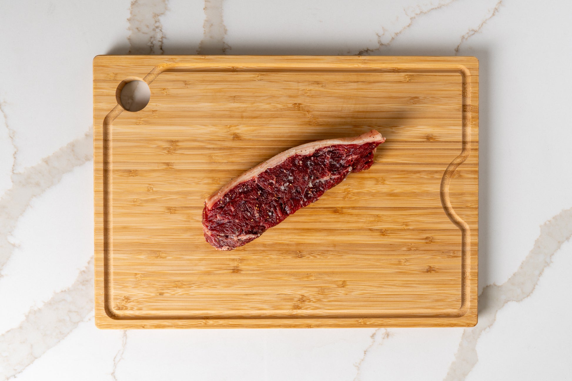 Raw KC strip steak – hand-cut 14oz Kansas beef, heritage meets innovation