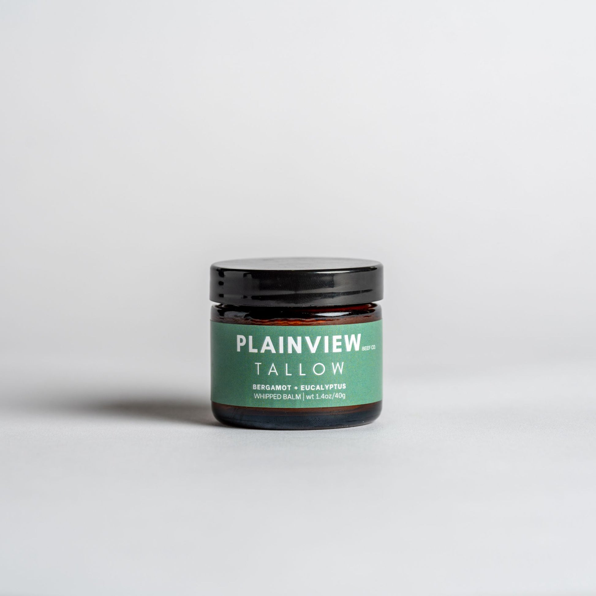 Jar of eucalyptus and bergamot tallow balm – natural spot treatment and redness relief.