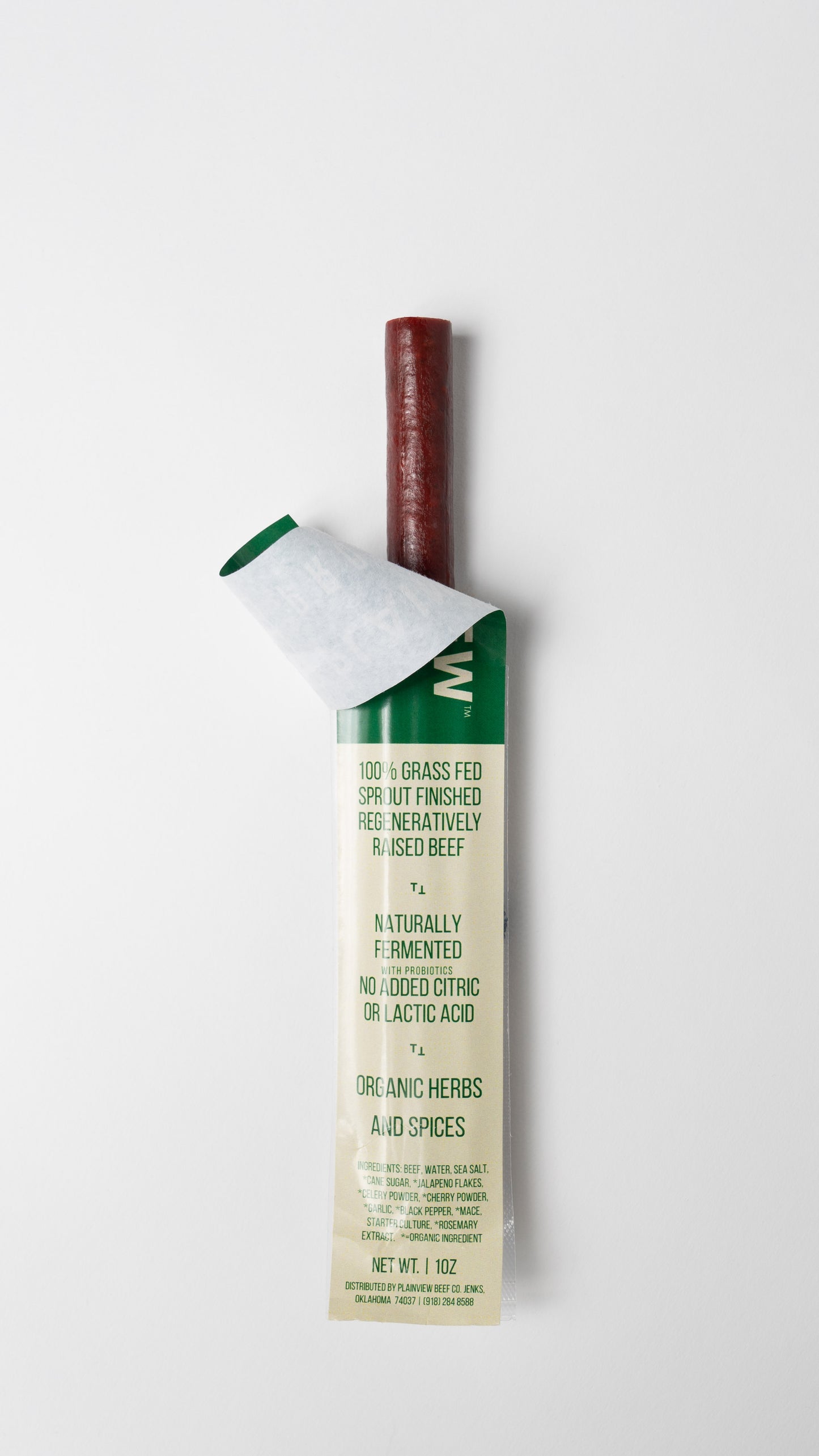 Packed organic naturally fermented beef steak sticks – clean high-protein snack; opened packaging.