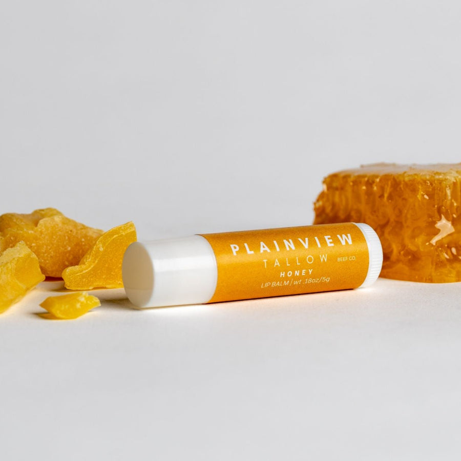 Unscented tallow honey lip balm with honey on the side