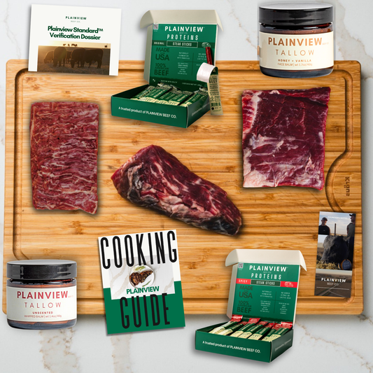 Plainview Proteins products including raw meat, tallow, and cooking guide on a wooden cutting board.
